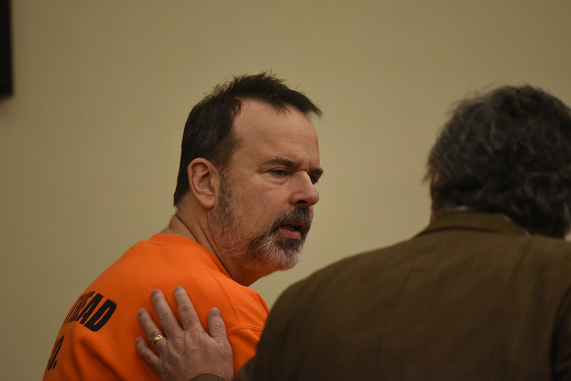 Nicholas Oberling speaks with defense attorney Sean Hinchey after pleading guilty to felony criminal endangerment in Flathead County District Court on Monday, Nov. 28. (Derrick Perkins/Daily Inter Lake)