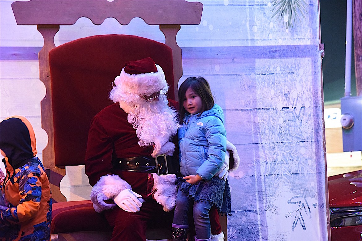 Troy youths shared their Christmas wishes with Santa Claus at the annual lighting of the Christmas tree in Troy Saturday evening. (Scott Shindledecker/The Western News)