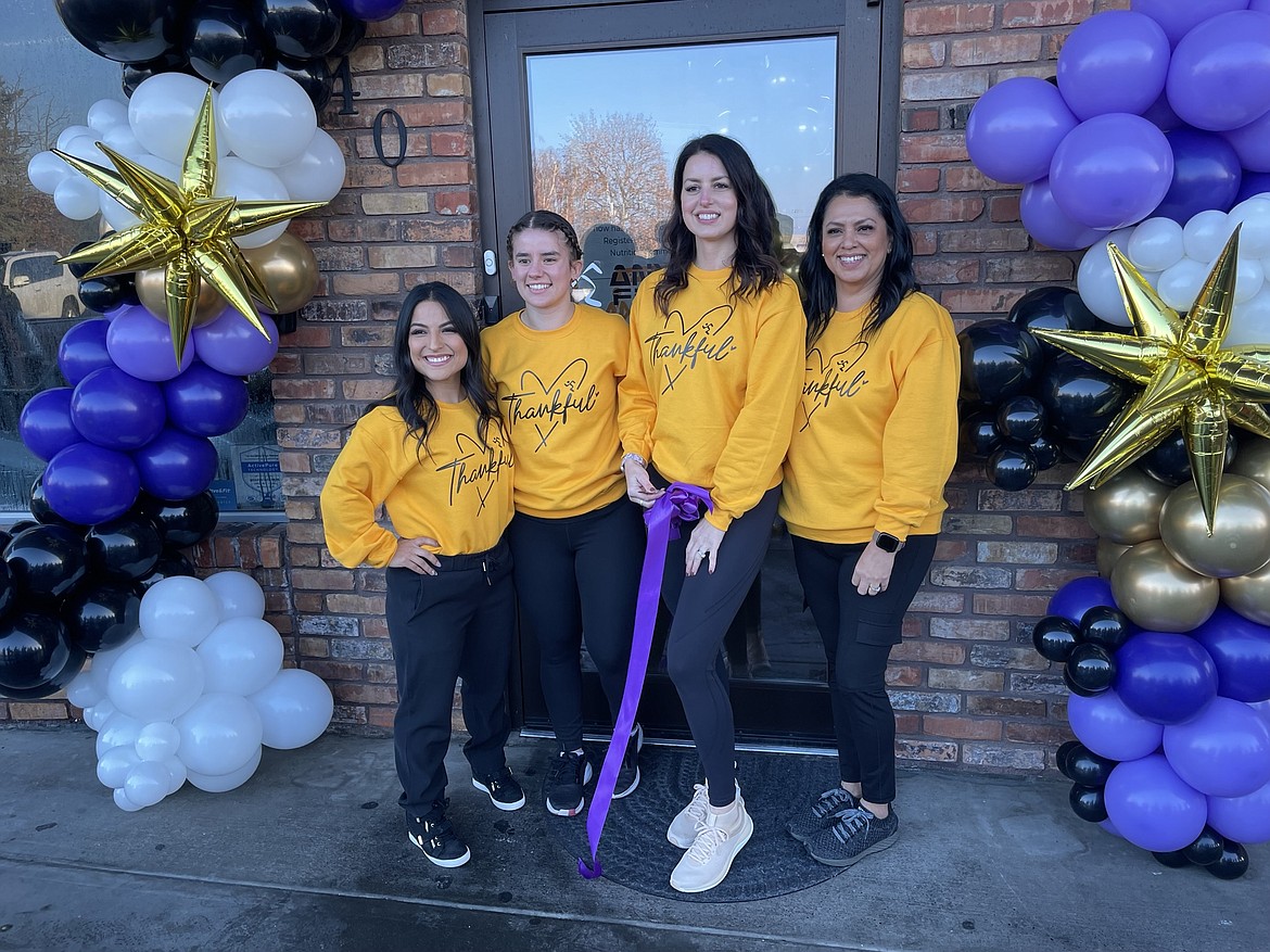 The Othello Anytime Fitness staff, (from left) Marie Charles, Reagan Heist, owner Jitka Garza and Michelle Garza, celebrated with a ribbon cutting Nov. 23.
