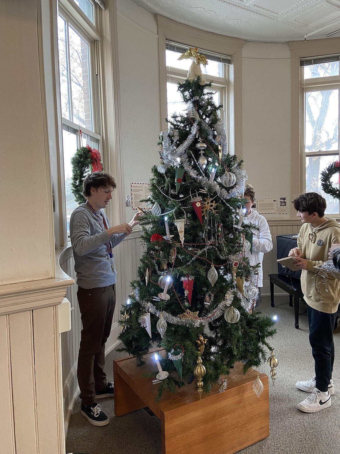 A Kalispell Middle School teacher and students help decorate the Northwest Montana History Museum for the holidays. (Photo courtesy of Susan Bradley)