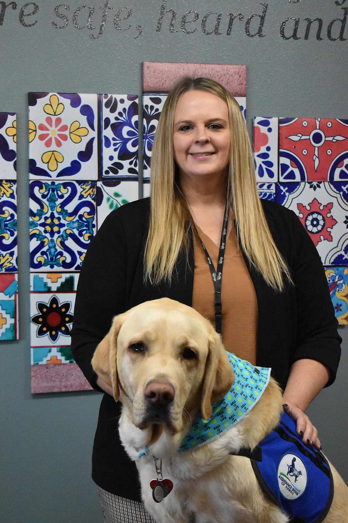 Elisa Adolphsen, Children’s Advocacy Center Coordinator at Kids Hope, poses with Valor.