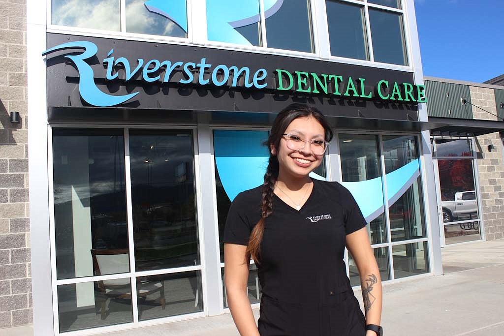 Mariah Aripa, 20, stands in front of her new workplace at Riverstone Dental Care in
Post Falls. Aripa is the first graduate of the North Idaho College Workforce Training Center’s new dental assistant apprenticeship program.