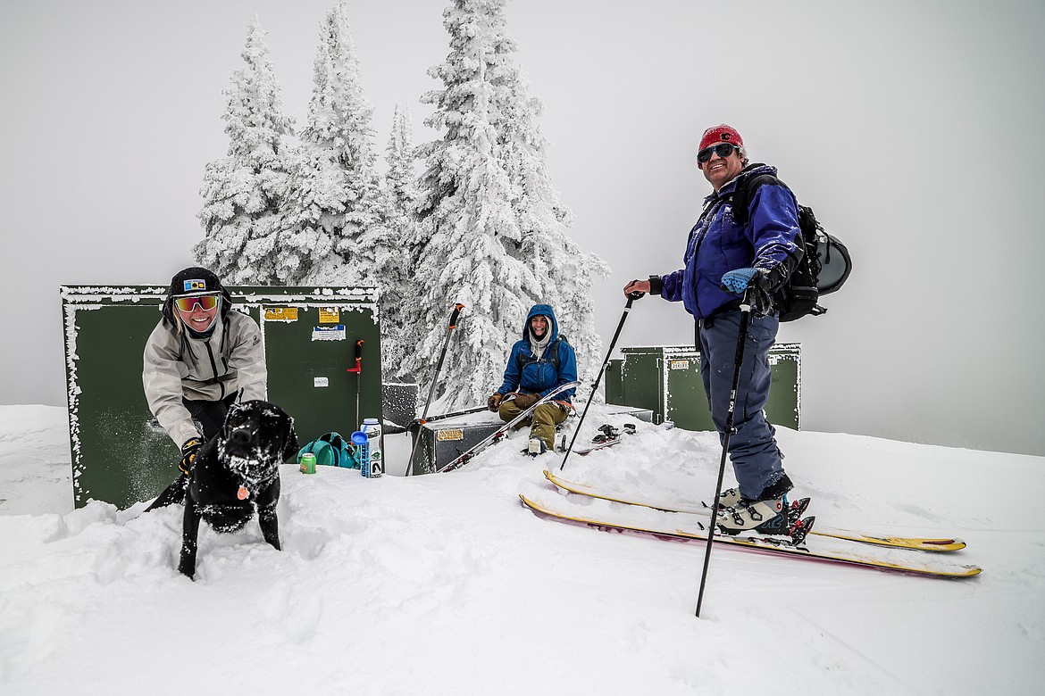 Skiers at the summit of Big Mountain before Whitefish Mountain Resort’s opening, from left, Sophie Garrubbo, Schafer the dog, Maureen Hunt and Lee Beers. (JP Edge photo)