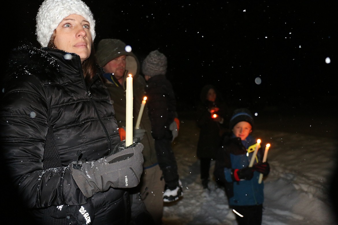 A Sandpoint resident gathers for a candlelight vigil honoring four University of Idaho students who were killed Nov. 13.