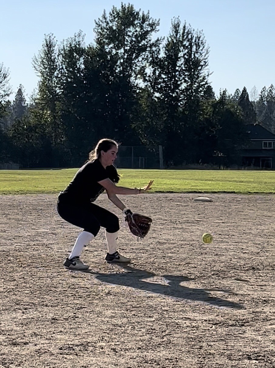 Kaylee McCown of Sandpoint puts in the work on her fielding mechanics