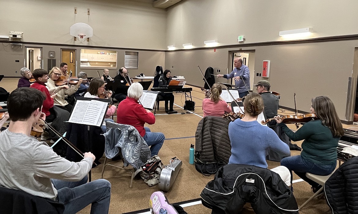 Kent Kimball conducting "The Trumpet Shall Sound" from Handel's Messiah in rehearsal with the professional orchestra for the Music Conservatory's sing-along production this Sunday, Dec. 4.