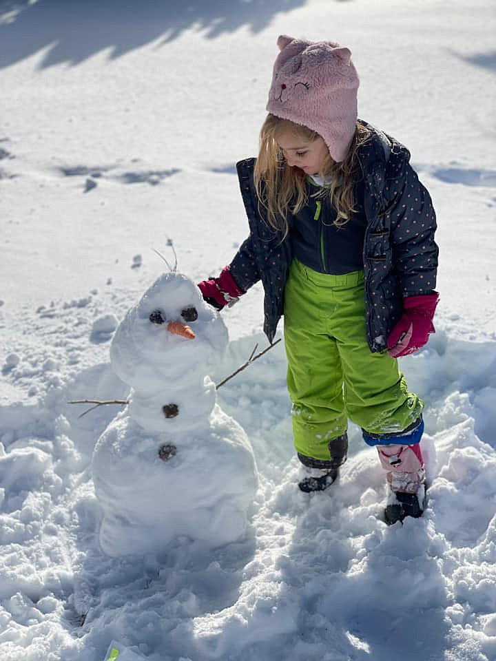 Nora Larson of Ephrata puts the finishing touches on her snowman friend Wednesday. We're sure 'Frozen's" Olaf would be proud to hang out with another handsome snowman.