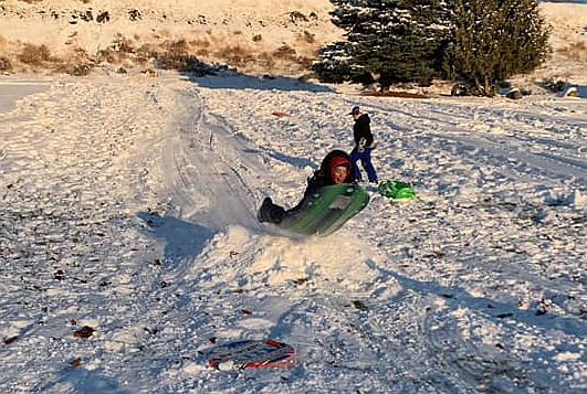 Elijah Perez, 11, of Moses Lake gets a little air on his way down a hill at Cascade Park Wednesday.
