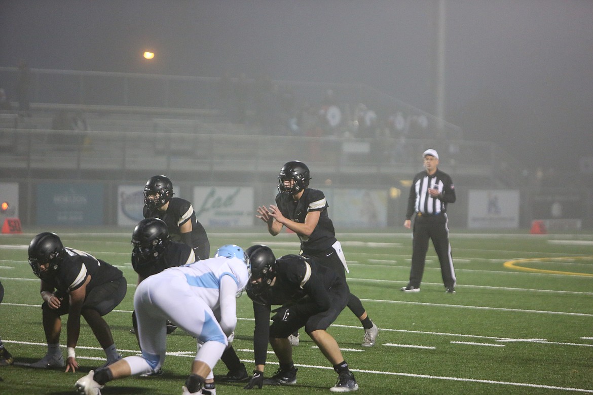 Royal quarterback Dylan Allred sits in the shotgun before calling for the snap in last week’s 57-21 win over Freeman in the 1A state semifinals.