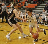 PREP BOYS BASKETBALL: Strawn shines for Lake City in opener