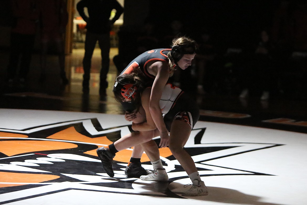 Senior Zoe Ellis attempts to perform a takedown against a Cashmere wrestler.