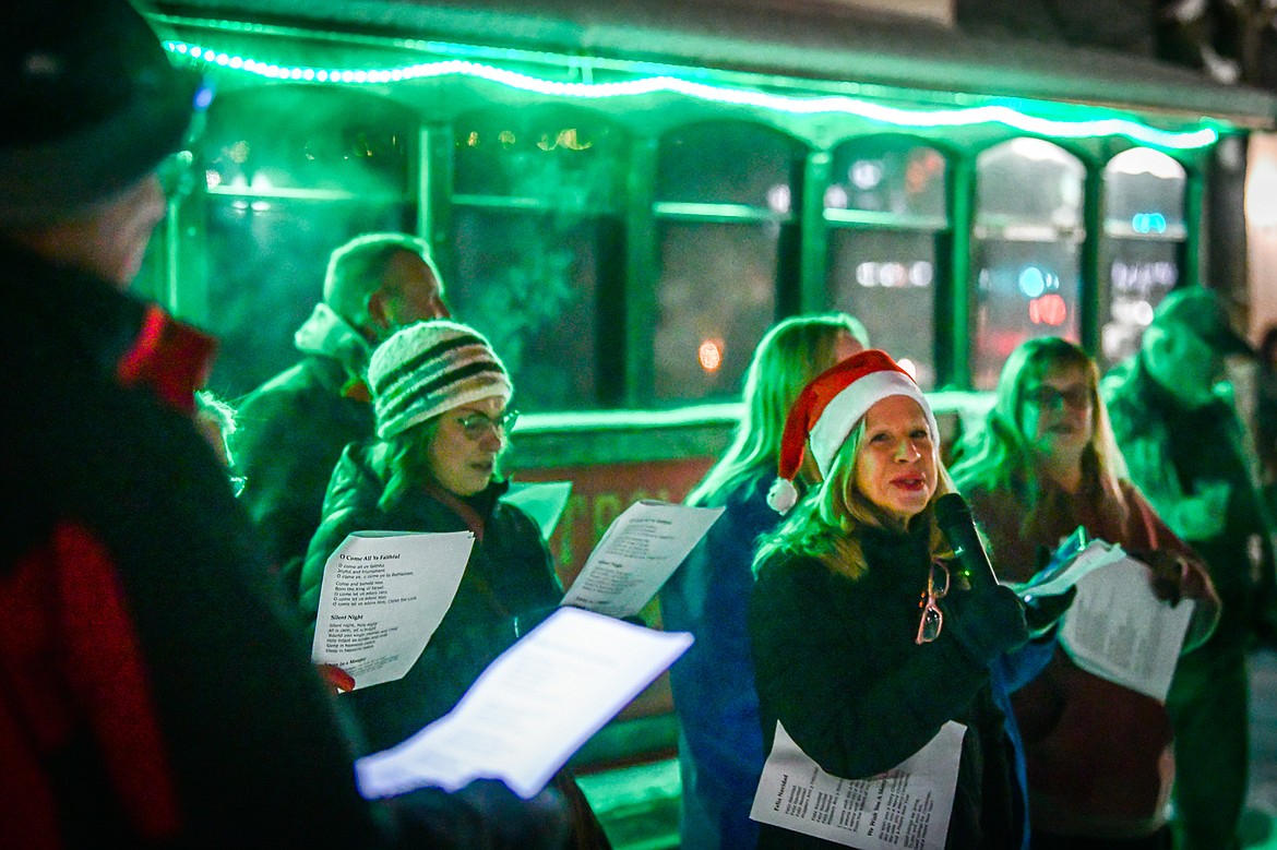Lucy Smith and friends sing Christmas carols with the crowd at the Community Tree lighting held by the Kalispell Downtown Association and Kalispell Business Improvement District at Depot Park during the Downtown Kalispell Holiday Stroll & Tree Lighting on Friday, Dec. 2. (Casey Kreider/Daily Inter Lake)