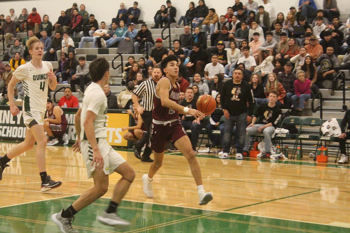 Wahluke’s Kacy Hirai (2) drives to the basket during the Warriors’ 71-53 loss to Quincy Friday.