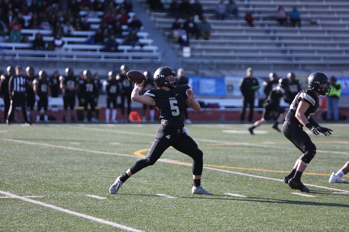 Royal quarterback Dylan Allred drops back to pass in the Knight’s 35-20 win over Mount Baker in the 1A state title game.