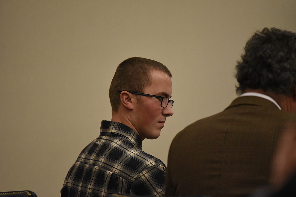 Gunnar Thomas Sweem sits with his attorney, Sean Hinchey, at the defendant's table during his Dec. 1 sentencing in Flathead County District Court. (Derrick Perkins/Daily Inter Lake)