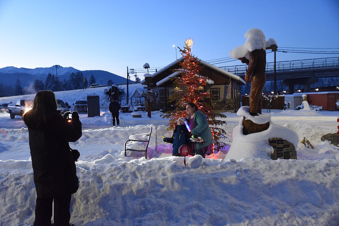 Christmas revelers enjoyed the lighting of the Christmas tree  on Saturday night at Mineral Park. (Scott Shindledecker/The Western News)