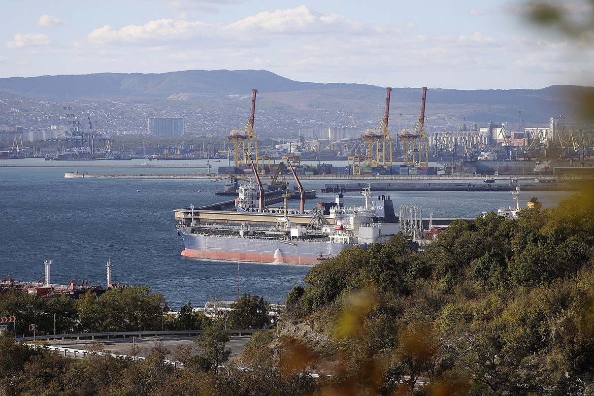FILE - An oil tanker is moored at the Sheskharis complex, part of Chernomortransneft JSC, a subsidiary of Transneft PJSC, in Novorossiysk, Russia, on Oct. 11, 2022, one of the largest facilities for oil and petroleum products in southern Russia. Oil prices rose Monday Dec. 5, 2022 as the first strong measures to limit Russia's oil profits over the war in Ukraine took effect, bringing with them uncertainty about how much crude could be lost to the global economy through the new sanctions or Russian retaliation. (AP Photo, File)