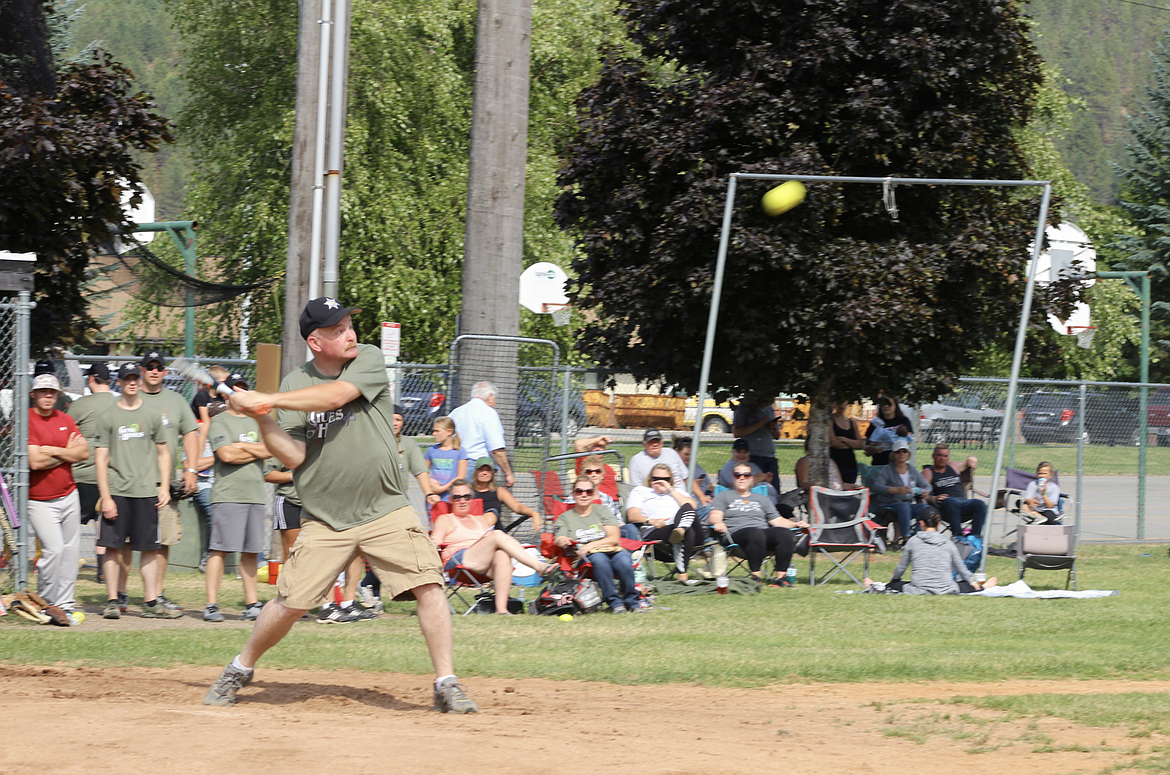 Sheriff Gunderson swings for the fences in a 2017 charity softball game in Kellogg.