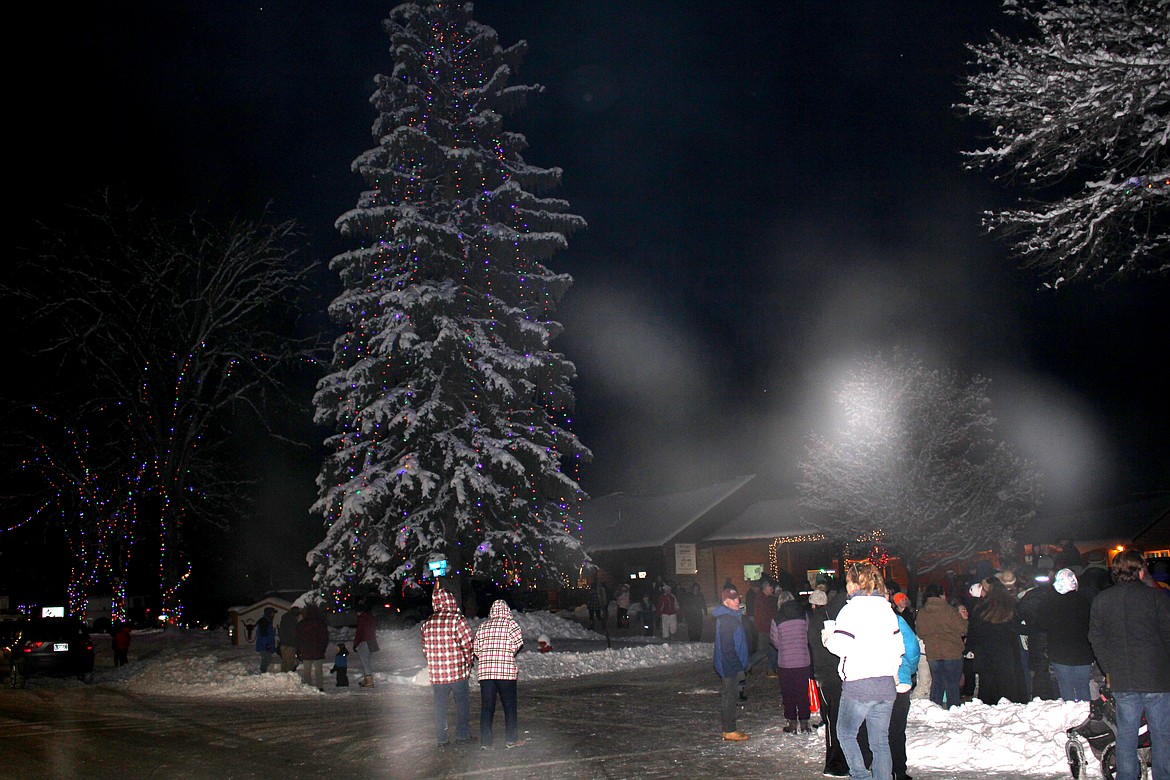 The huge tree on the corner of River Street and 3rd Avenue East was the centerpiece, but all of the trees were lit around 5:30 p.m. on Saturday while hundreds of people enjoyed the festivities and friendship of the first Superior Christmas Tree Lighting. (Monte Turner/Mineral Independent)