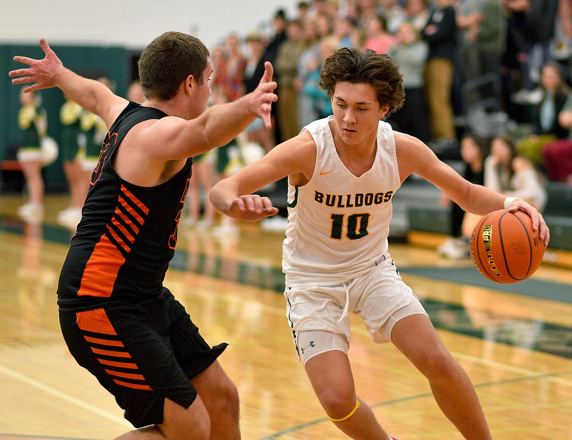 Whitefish junior Mason Kelch dribbles the ball into the paint during a game against Eureka on Friday in Whitefish. (Whitney England/Whitefish Pilot)