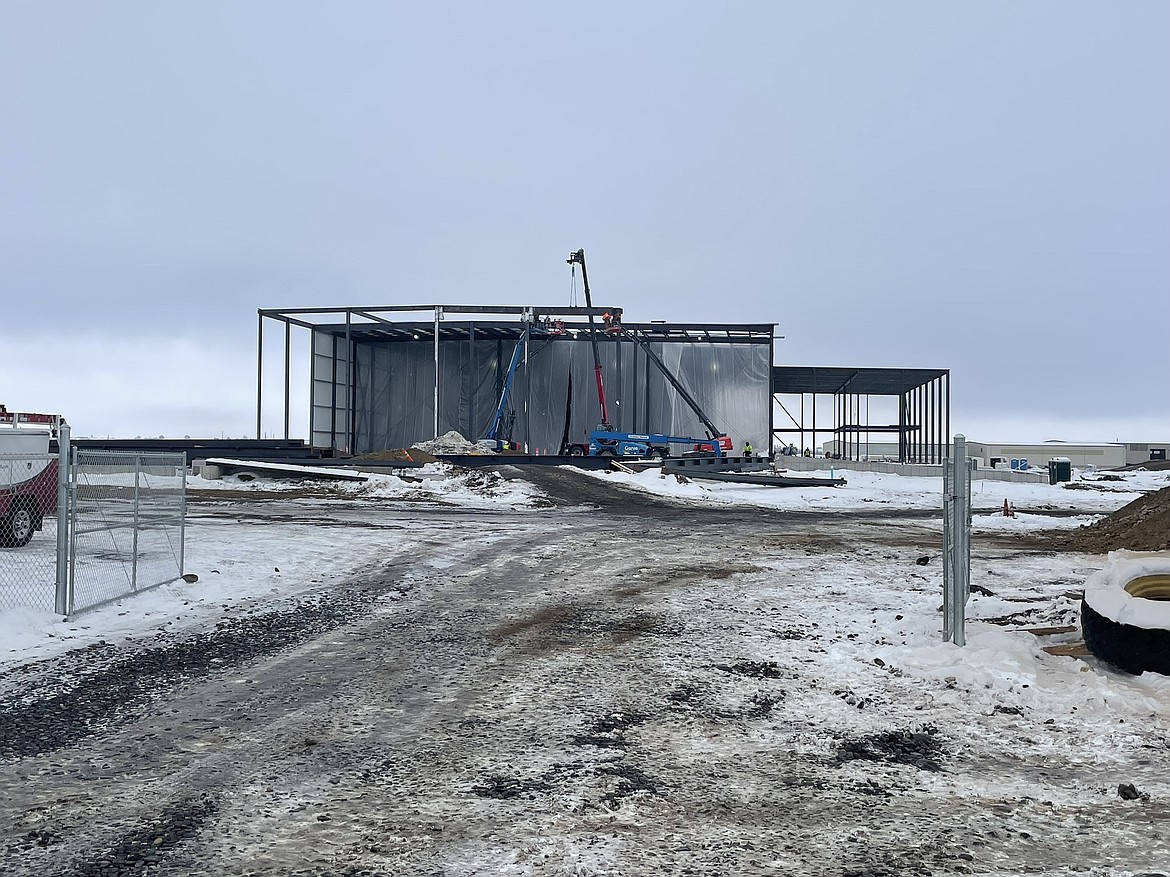 Workers building the 66,000-square-foot apple processing facility on North Randolph Road.