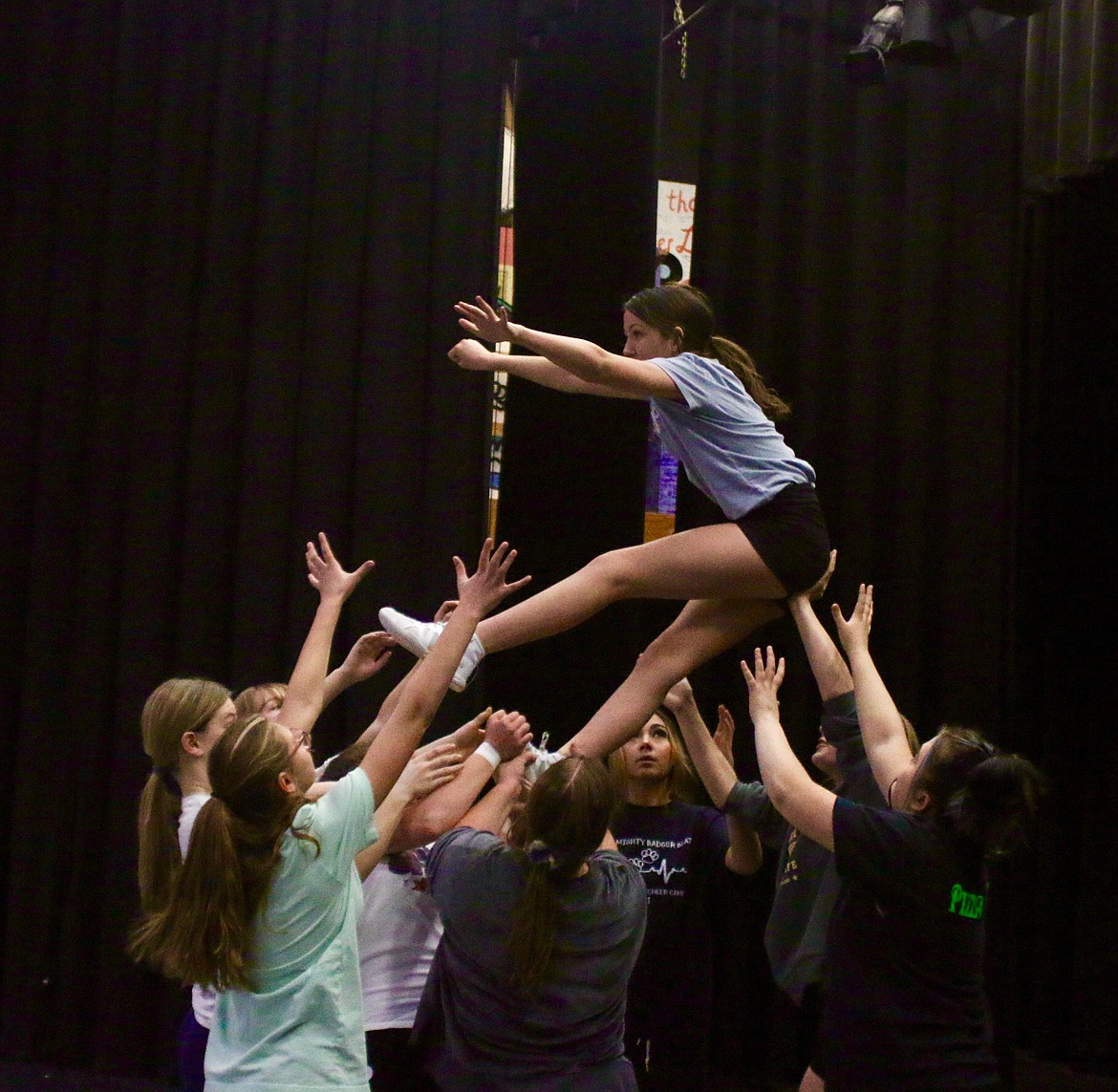 Badger cheer attempts a lift at practice.