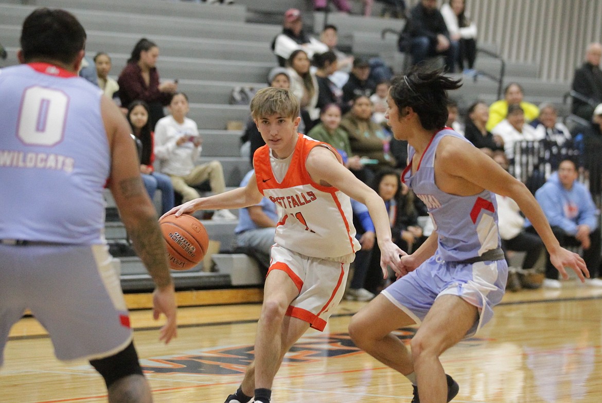 MARK NELKE/Press
Cobe Cameron (11) of Post Falls looks for room to operate against Lapwai on Tuesday night in Post Falls.