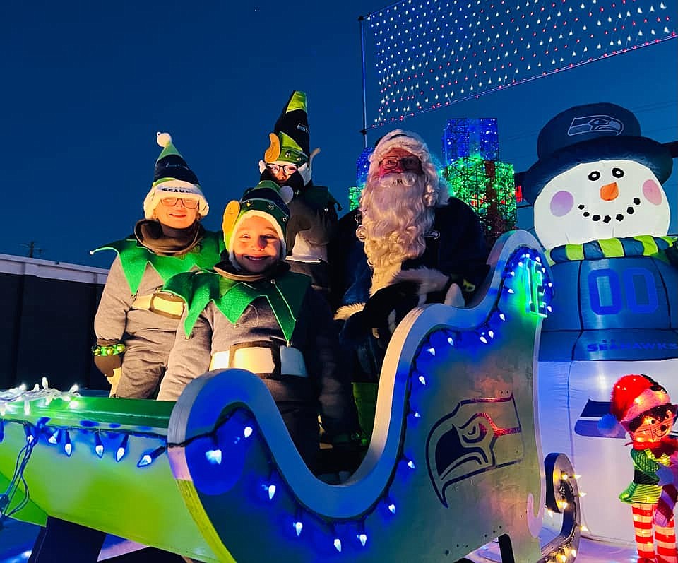Seahawks Santa and his elves on their ride in downtown Othello. The community came out to celebrate Christmas and enjoy time as a community in spite of cold weather.