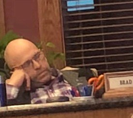 A screenshot of a video posted to Facebook shows Flathead County Commissioner Brad Abell sleeping at a public meeting on Dec. 1.