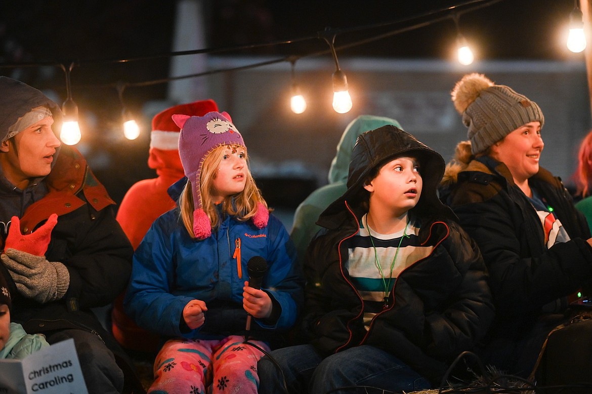 A wagon load of carolers warmed the chilly night for the St. Ignatius Parade of Lights. (Christa Umphrey)