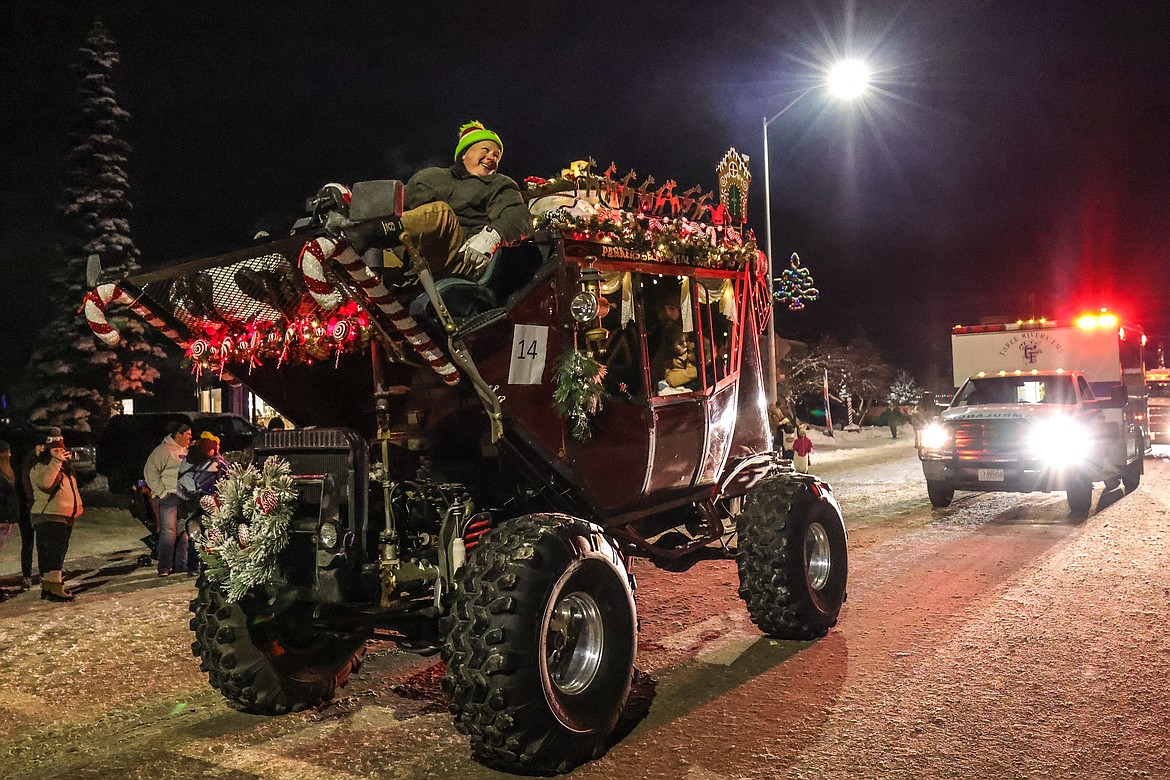 A Christmas-themed stagecoach makes its way down Nucleus Avenue during the Night of Lights Parade on Friday. (JP Edge photo)