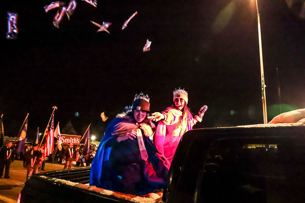 Night of Lights prince and princess Hunter Pyles and Kya West throw candy to the crowd while cruising down Nucleus Avenue. (JP Edge photo)