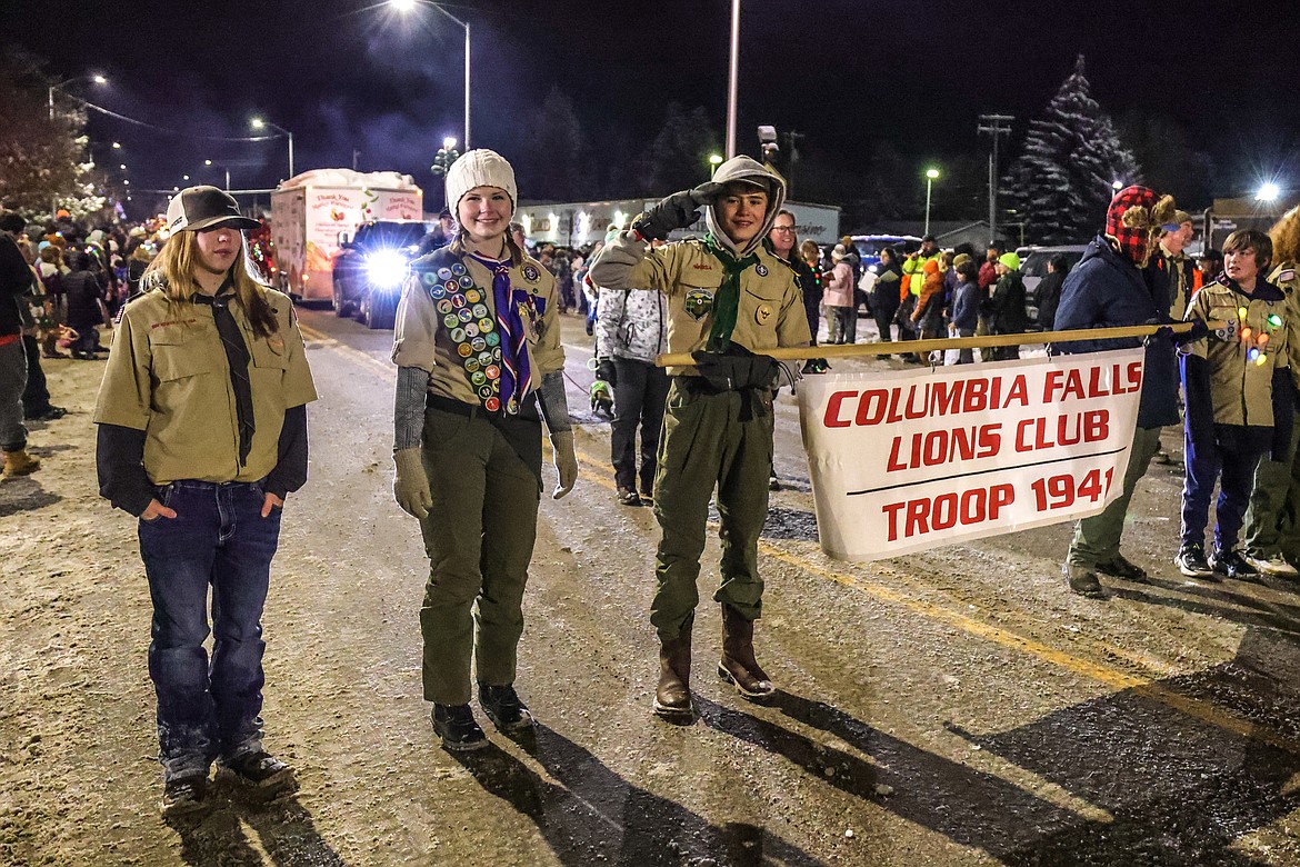 Members from troop 1941 salute in the Night of Lights Parade on Friday. (JP Edge photo)