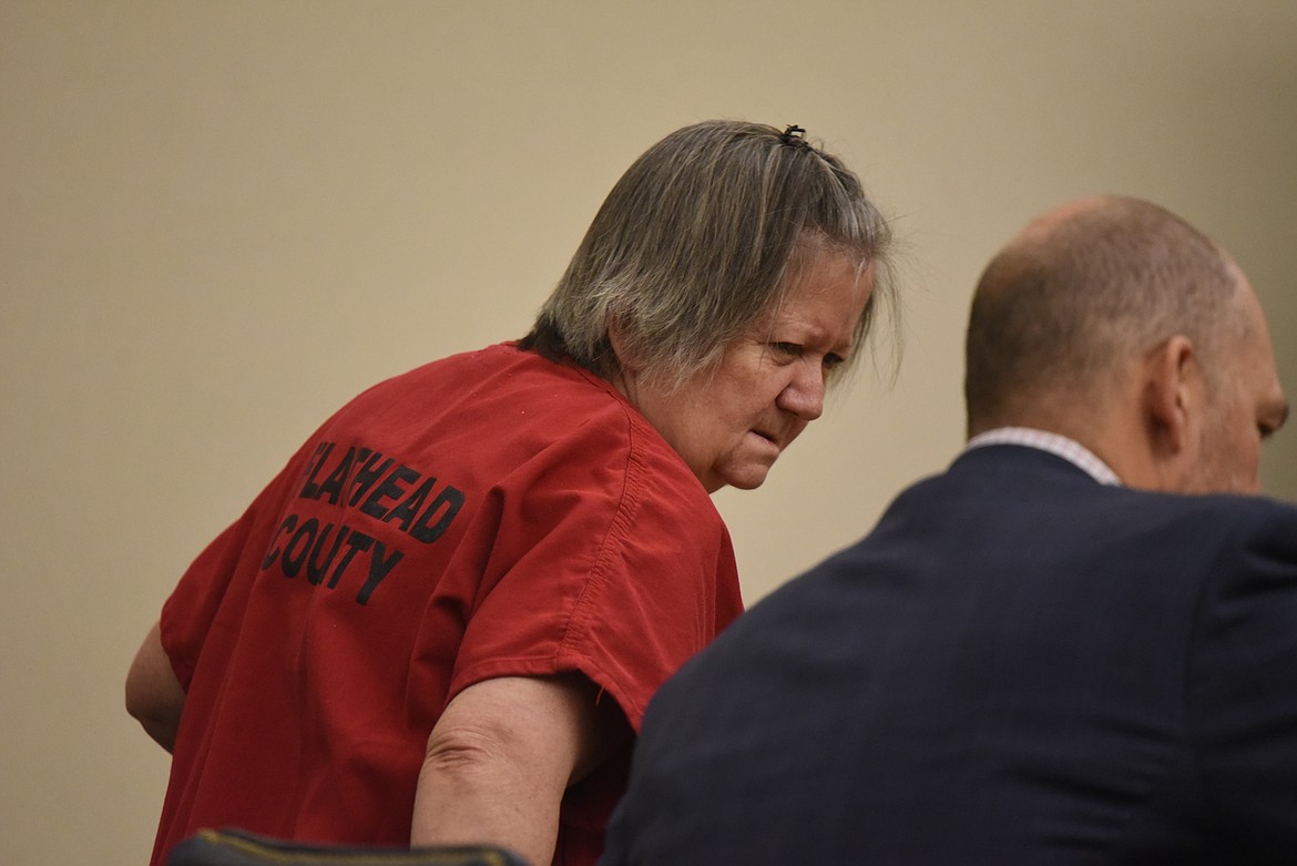 Kay Lynn Johnson sits beside her defense attorney at her change of plea hearing in Flathead County District Court on Wednesday, Dec. 7. (Derrick Perkins/Daily Inter Lake)