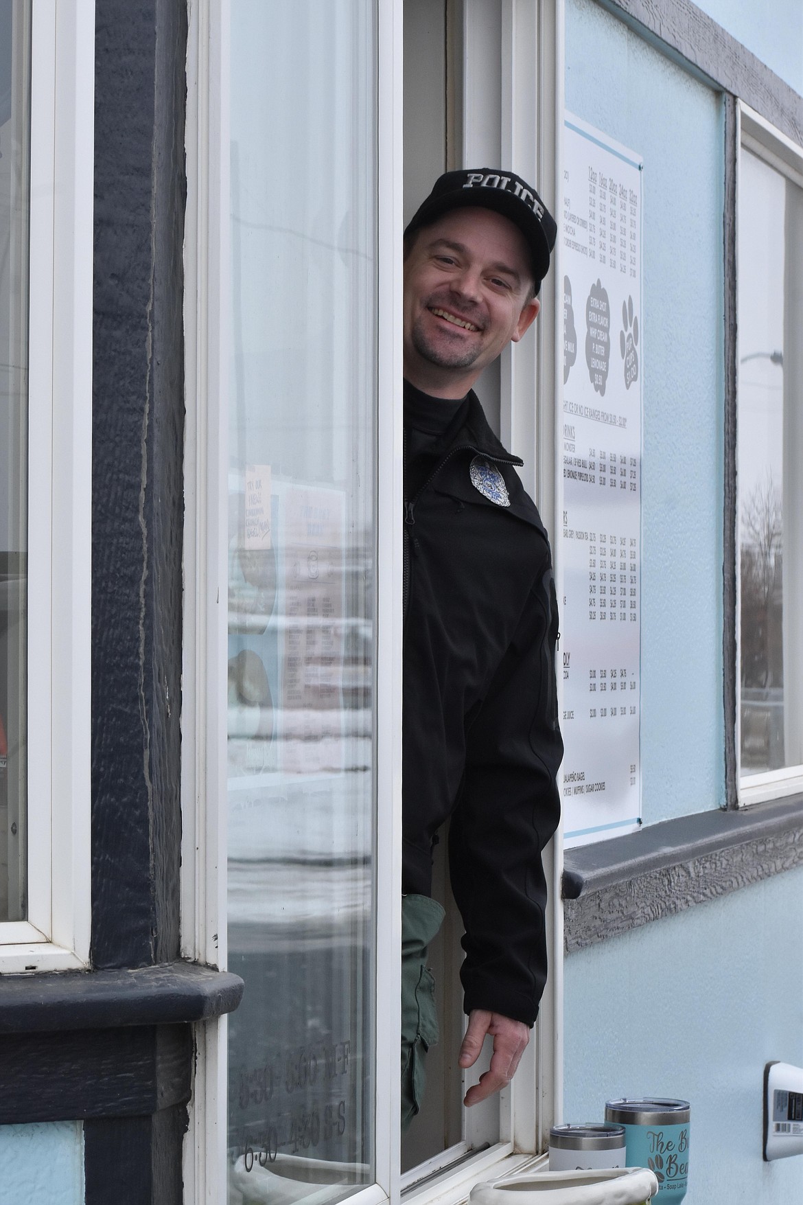 Soap Lake Police Officer Robert Geates was ready for customers Tuesday morning during Tip-a-Cop at The Busy Bean in Soap Lake.