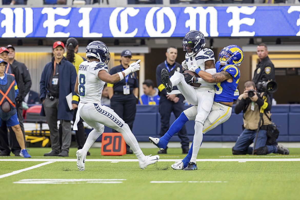 Seahawks cornerback Tariq Woolen intercepted his sixth pass of the season against the Rams on Sunday, tied for the most in the NFL and setting a team record for most intercepted passes by a rookie.