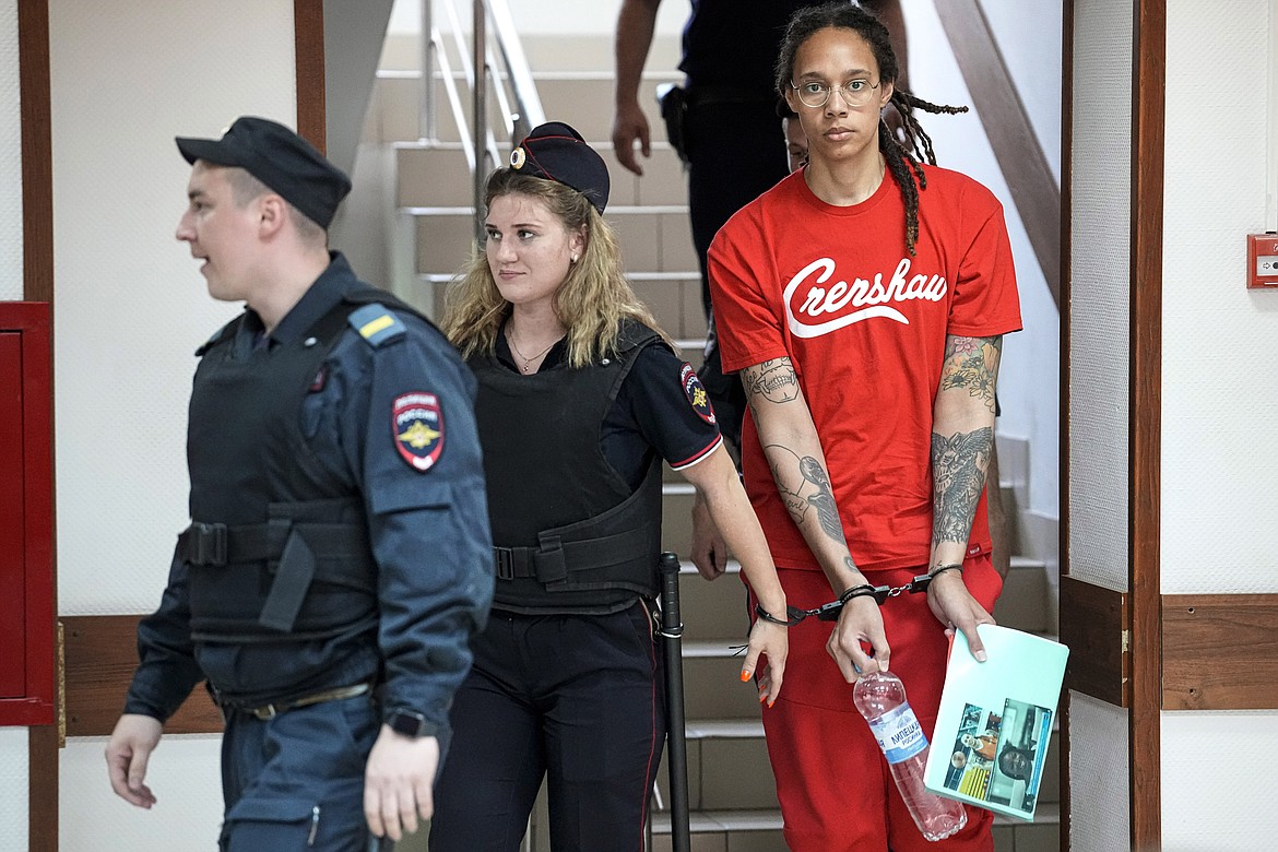 WNBA star and two-time Olympic gold medalist Brittney Griner is escorted to a courtroom for a hearing in Khimki just outside Moscow, on July 7, 2022. Russia has freed WNBA star Brittney Griner on Thursday in a dramatic high-level prisoner exchange, with the U.S. releasing notorious Russian arms dealer Viktor Bout. (AP Photo/Alexander Zemlianichenko, File)