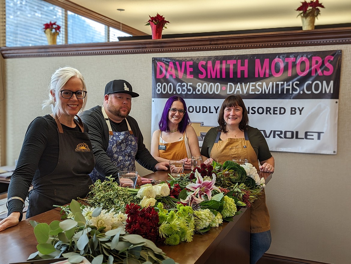 Keri Alexander, Danny Kenyon, Molly Roberts and Sarah Murphy took a minute for a quick picture before Murphy guided them on a crash course in centerpiece design.