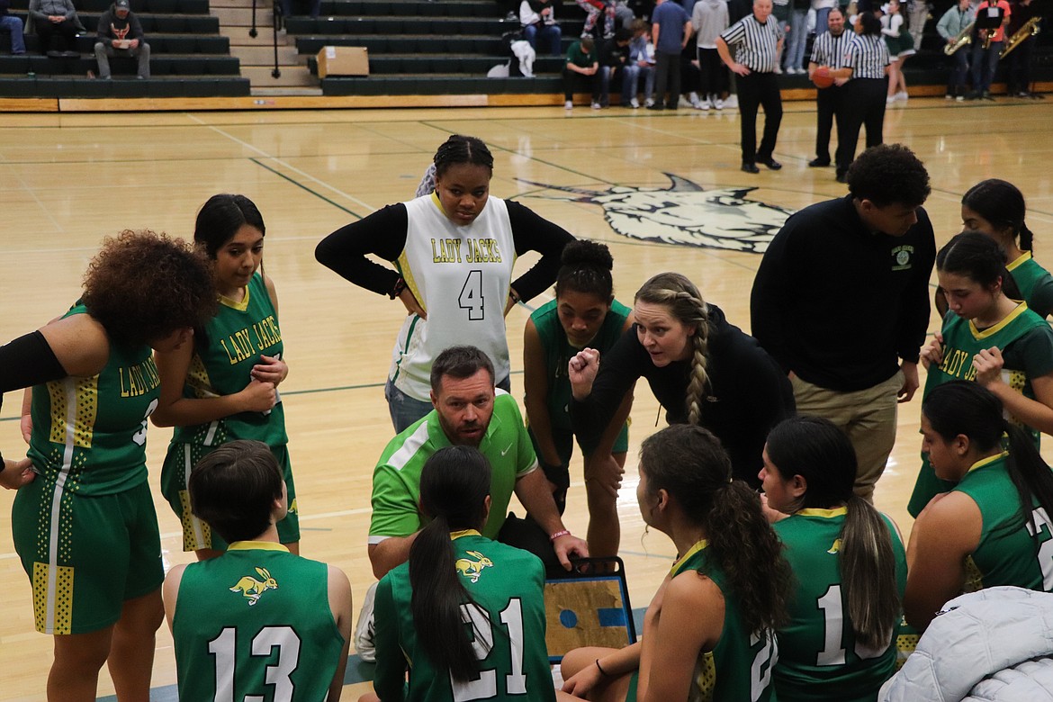 Quincy players and coaches gather on the sideline during the Jackrabbits’ game against Chelan on Tuesday.