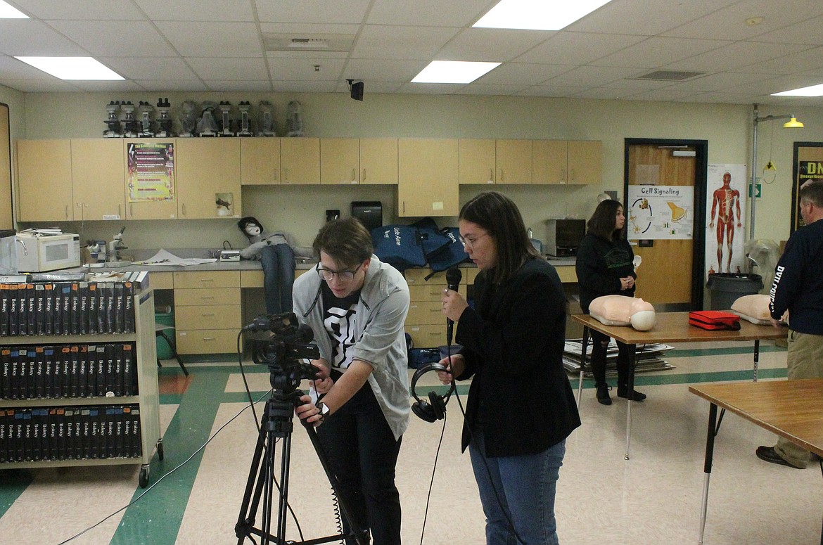 Paden Livingston, left, and Katie Carlson prepare to shoot a segment for Royal High School News.