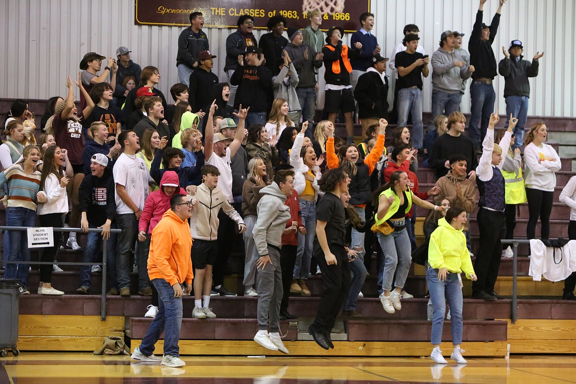 The Moses Lake student section celebrates after an Ellensburg missed free throw with no time on the clock, clinching a win for the Mavericks.