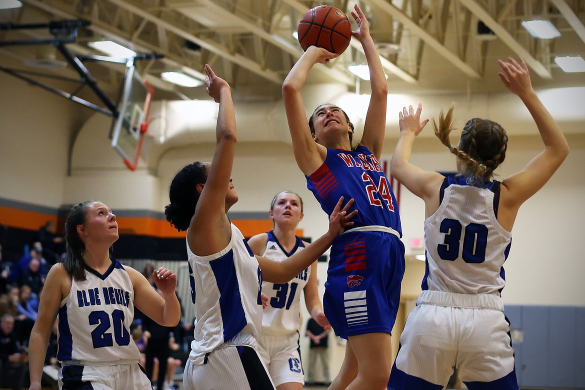 Columbia Falls guard Lexi Oberholtzer takes on four Corvallis defenders for a basket at the Frenchtown Tip Off Tournament on Friday, Dec. 9. (Jeremy Weber/Daily Inter Lake)