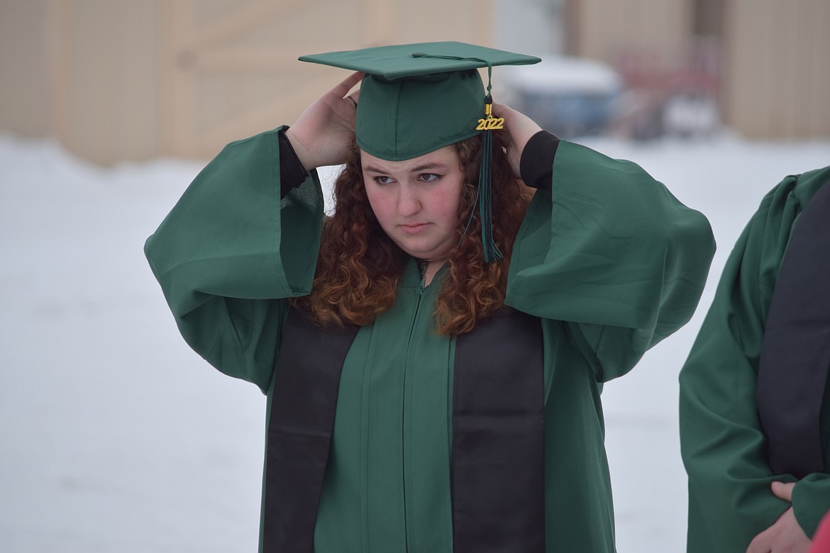 Renee Murphy fiddles with her mortar board as she prepares for graduation at the Columbia Basin Job Corps Center on Friday. Murphy was one of eight young people to graduate in December in the center’s first graduation ceremony since the imposition of lockdowns and restrictions in response to the outbreak of COVID-19 in early 2020.