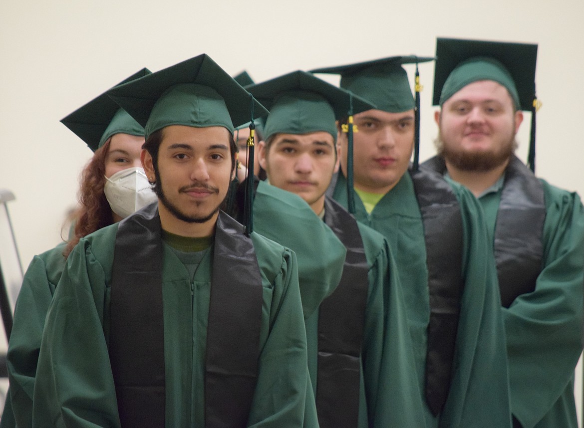 Columbia Basin Job Corps graduates (front to back) Diego Alcaraz-Clymer, Bridgette Davis (masked), Bryen Padilla, David Pruneda and Dylan Rich line up with fellow graduates Renee Murphy, Yulia Orduno-Hernandez and Suzanne Vargas in preparation to graduate on Friday in the center’s first public graduation ceremony since early 2020.