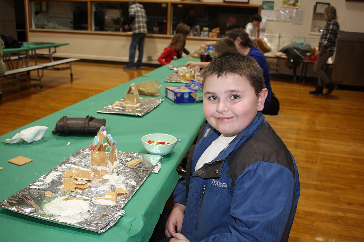 Korbin Criter, a third-grade student in Ms. Bergman's class, was a bit frustrated at first with initial structure failure, but rightly proud of his completed ranch-style home. (Monte Turner/Mineral Independent)