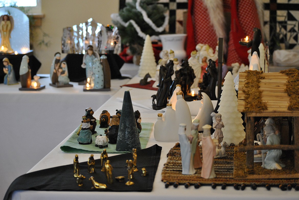 The St. Regis Senior Center was aglow on Saturday with a glorious display of Nativity sets. Organized by Linda Forest, the Biblical scenes were put out for all to enjoy as shoppers came and went from the Christmas Bazaar next door. Forest owns several of the nativity sets herself, and enjoys collecting a variety of whimsical displays. There was an adorable bear nativity set, a wild west version of a babe in a manger, and more classic sets made of shiny brass or intricate glassware. (Amy Quinlivan/Mineral Independent)