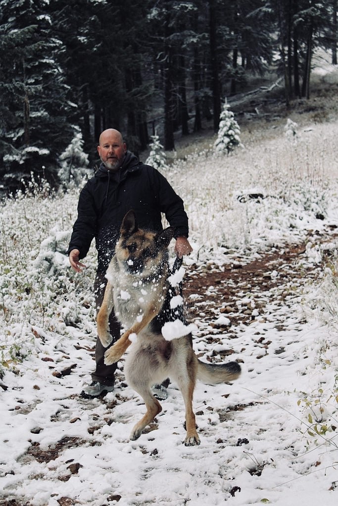 "This is my husband Jeff and pup Radar up on Canfield Mountain after the first snow. There wasn’t anything down in Cd'A yet. We’re from northern Minnesota, Jeff does travel work for hospitals and he ended up here at Kootenai until the end of December. Radar is beyond ecstatic to have some snow to play in — a Minnesota dog through and through!"