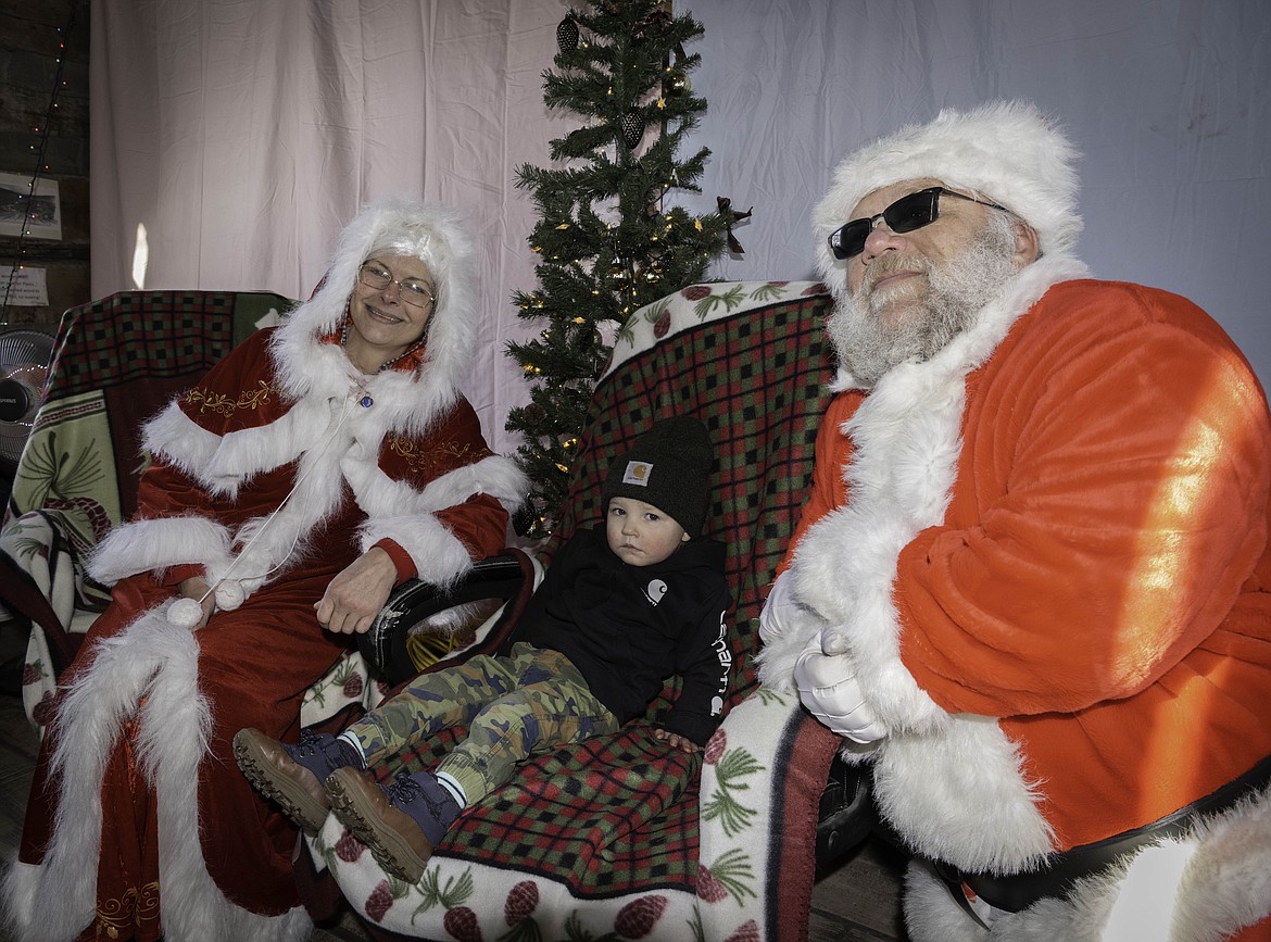 Leroy Wright, 20 months old, is a bit shy while meeting Santa in Plains. (Tracy Scott/Valley Press)