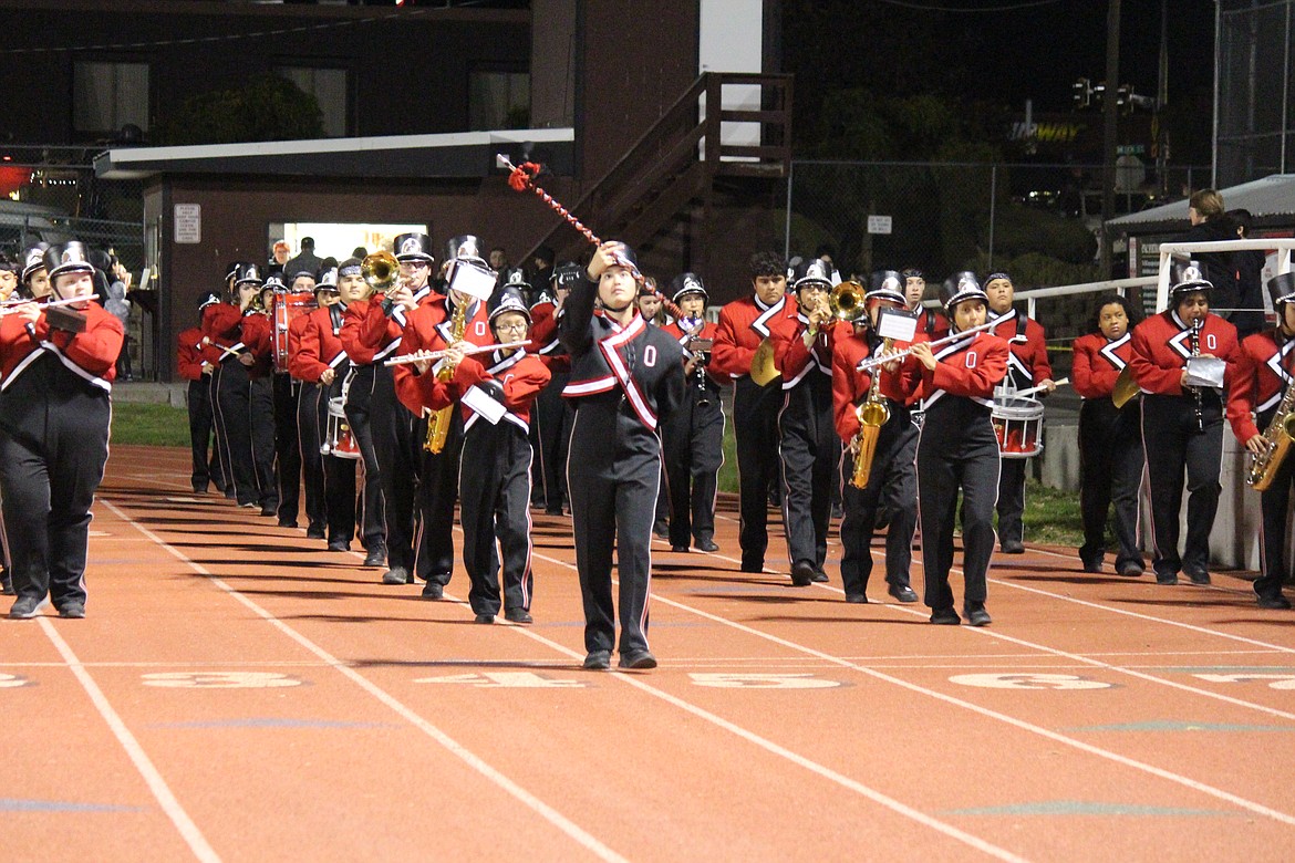 The marching band from Othello High School heads down the stretch during a performance at an October OHS football game. Levy funding helps the district maintain its arts programs.