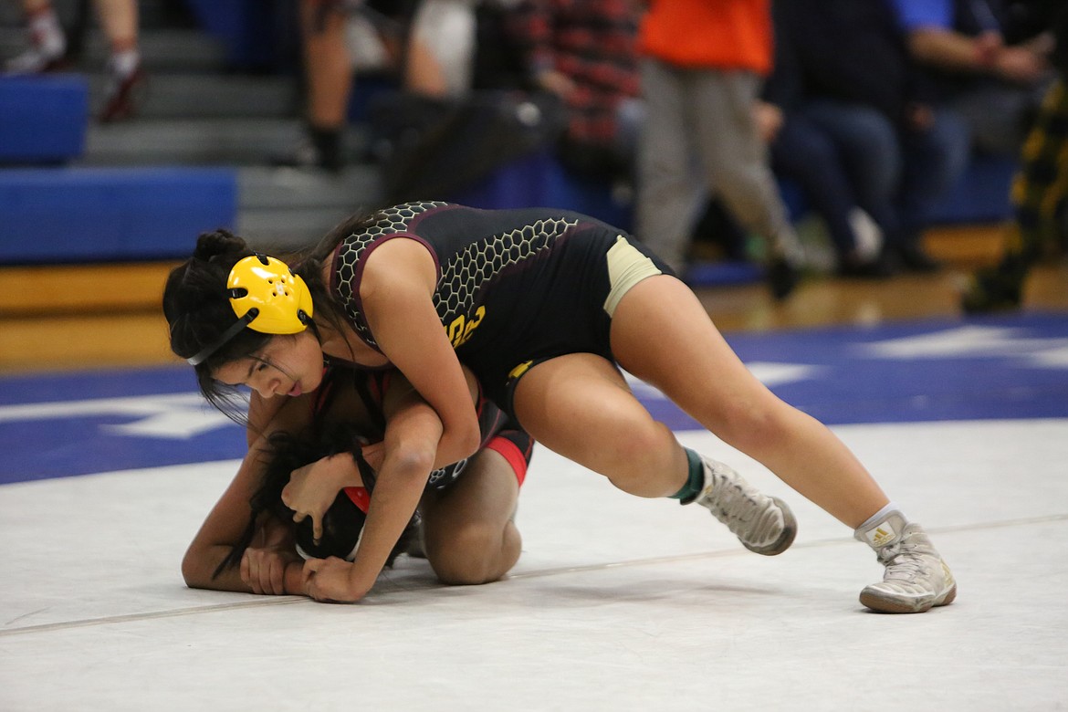 Moses Lake’s Elyssa Armendariz (top) placed third in the 105 class.